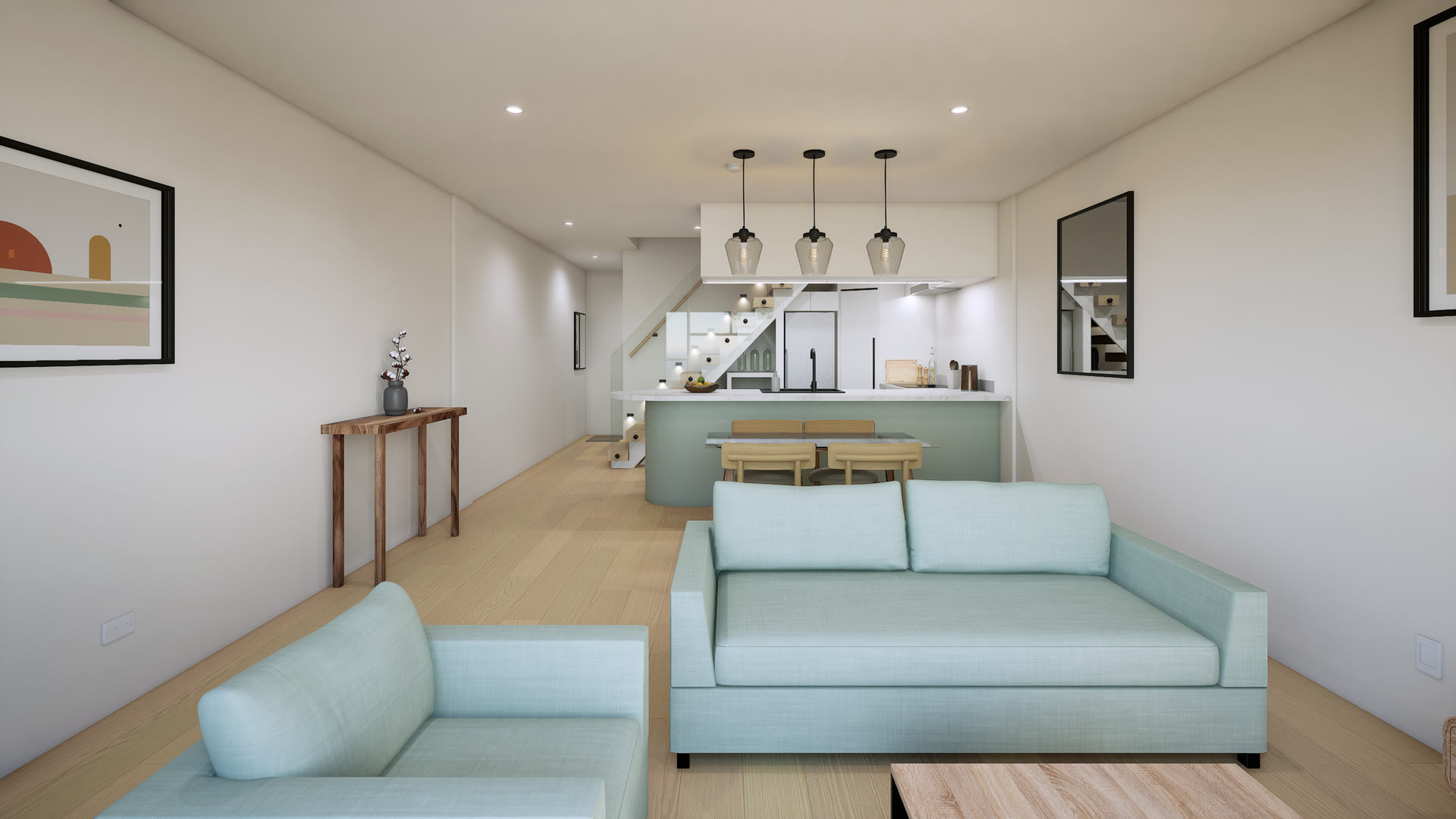 Long open-plan living room with two pale blue sofas, looking past the dining table to a kitchen island and a floating stair