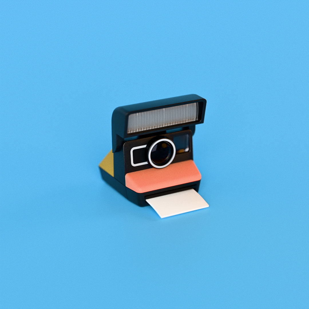 The instant camera: flash bar on top, lens in a black face, a coral band and a print half out