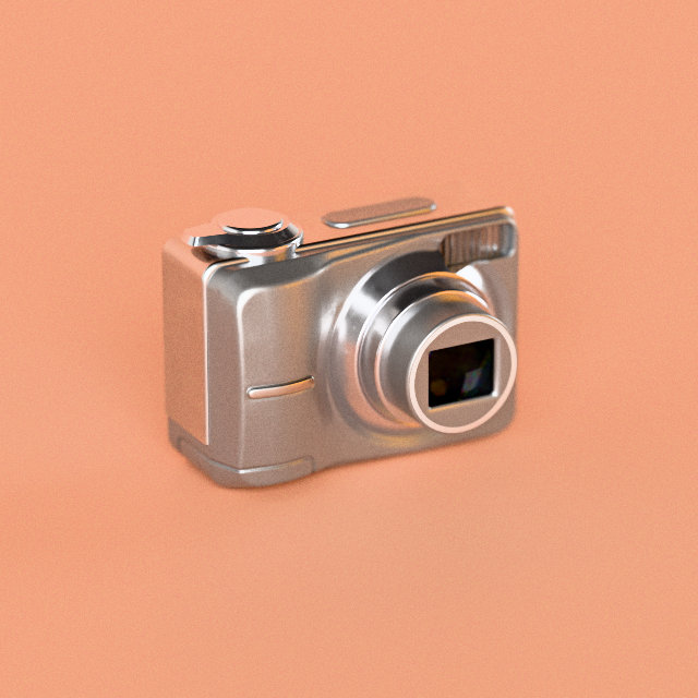 A silver 2000s-style compact digital camera, on peach