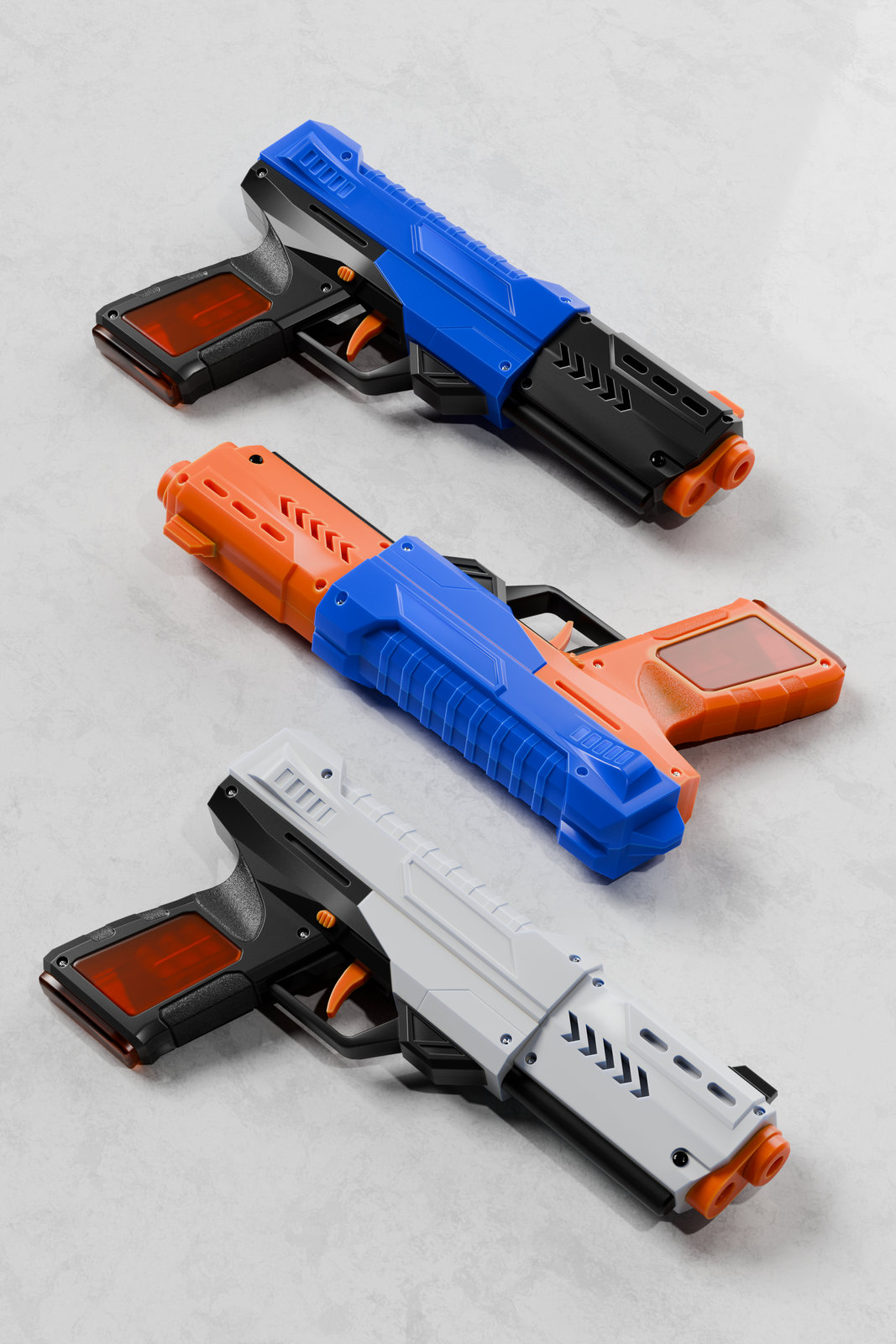 Three versions of the blaster on a pale concrete surface: blue and black, orange and blue, and light grey and black